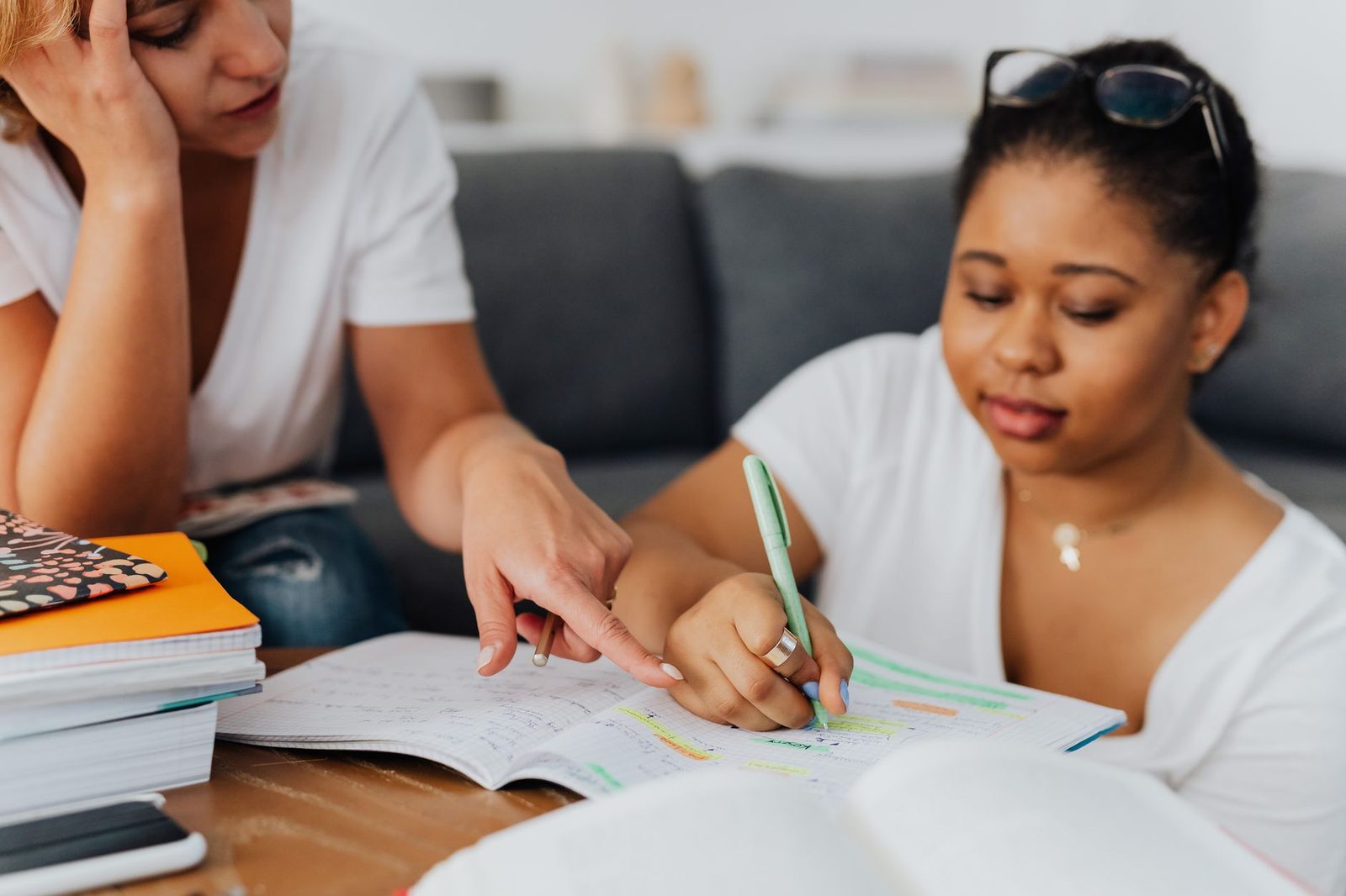 Student working one-on-one with a tutor at a desk