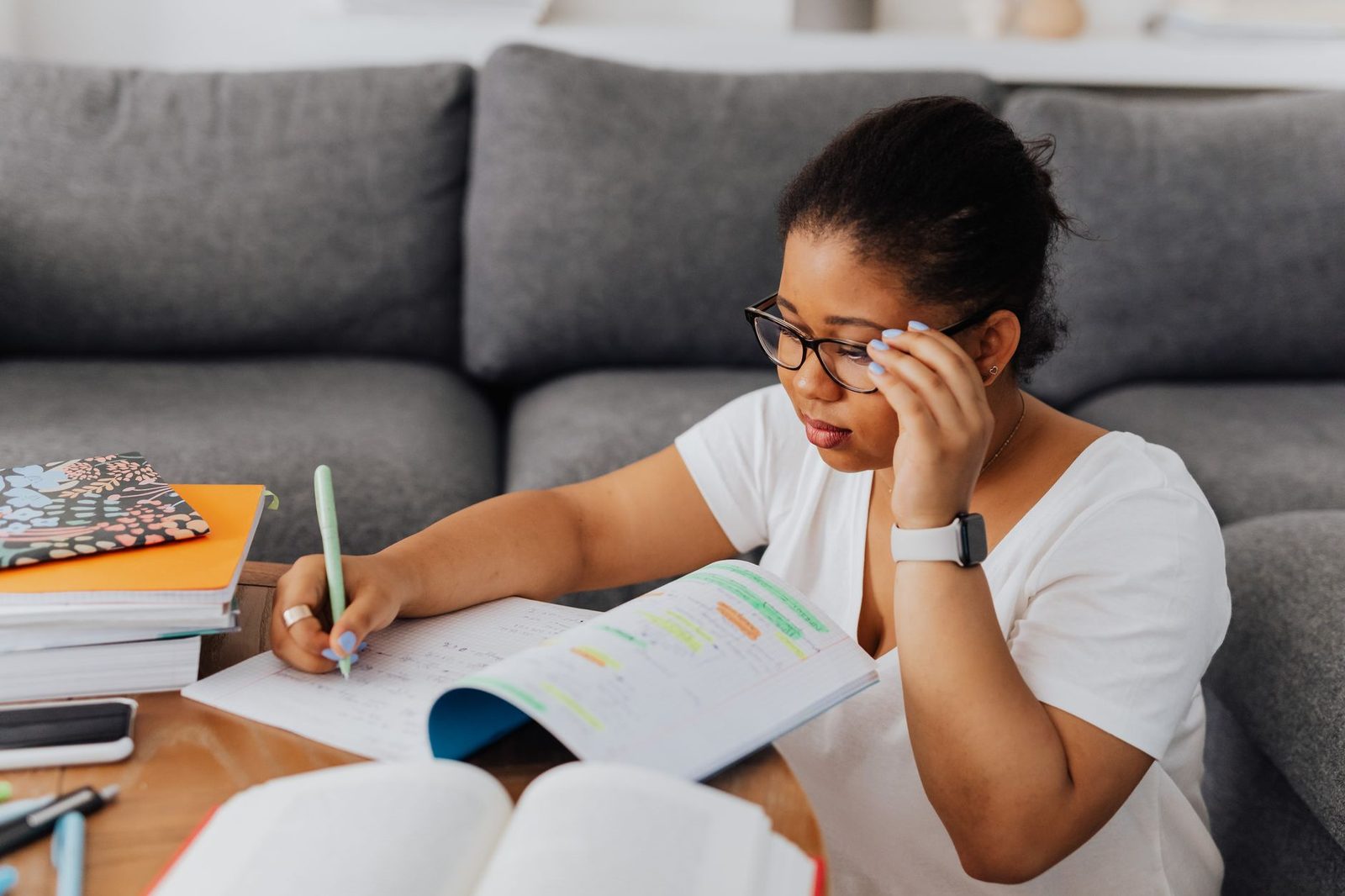 Student reviewing application checklist at desk