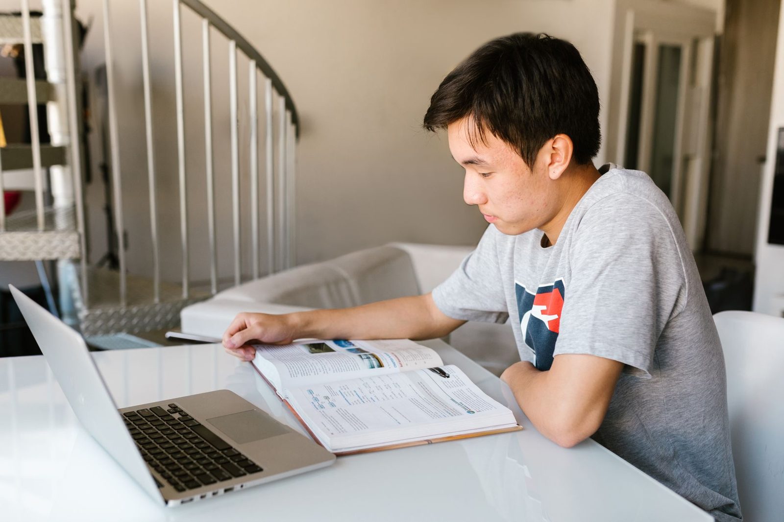 Student studying on a laptop preparing for the Digital SAT